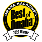 A circular yellow and black badge reads "Omaha Magazine's Best of Omaha Winner" with a white ribbon at the bottom displaying the year .