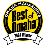 A yellow and black circular badge reads "Omaha Magazine's Best of Omaha Winner" with a white ribbon at the bottom.